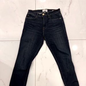 Frame high rise skinny jeans with small slit at the ankle.